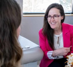 Littleton neurosurgeon Dr. Angela Bohnen talks with a patient.