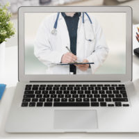 Picture of telehealth physician on computer screen.