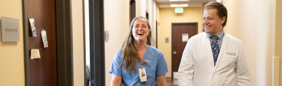 New Denver neurosurgeon, Dr. Randall Allison walking with PA Jaime Paige. Both providers recently joined Neurosurgery One in Lakewood, Colo.
