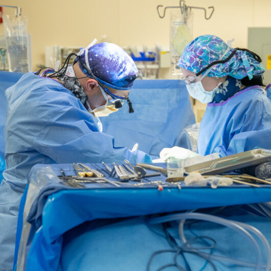 image of spine surgeons performing cervical disc replacement.