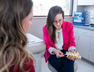 Dr. Angela Bohnen discusses spinal cord stimulation with a patient.