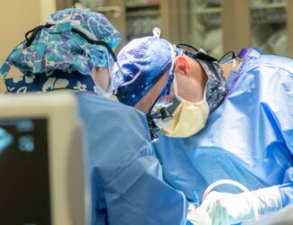 Surgeon performing spine surgery at a Colorado spine center.