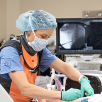 Anesthesiologist preparing a patient for back surgery.