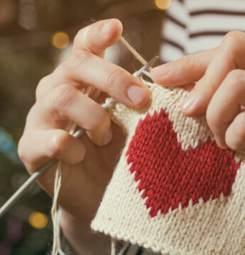 Hands knitting without pain a heart shape piece.